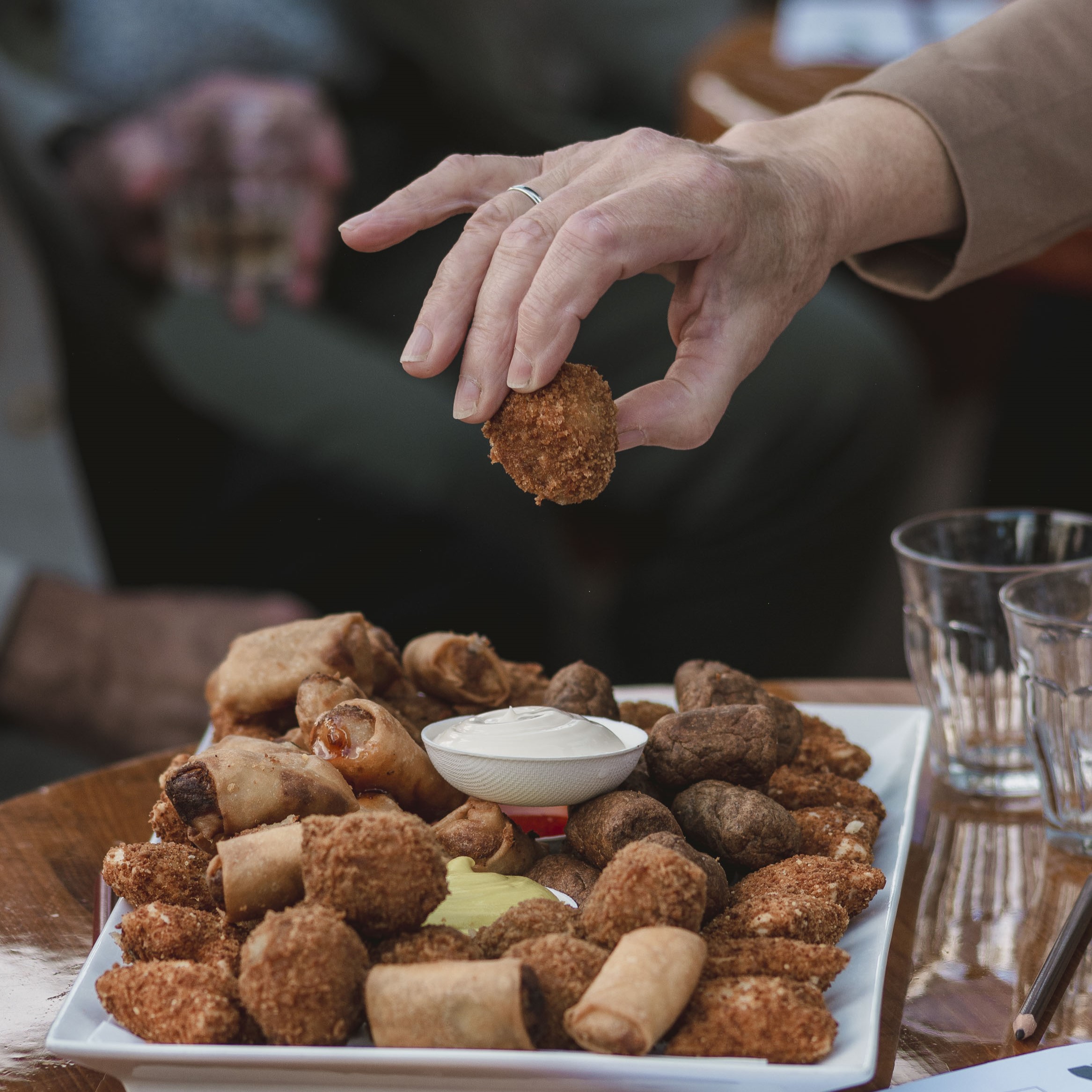 Wedding guest enjoying bitterballen in Amsterdam